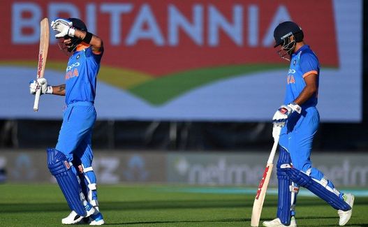 Virat Kohli and Shikhar Dhawan walk off the field | Getty