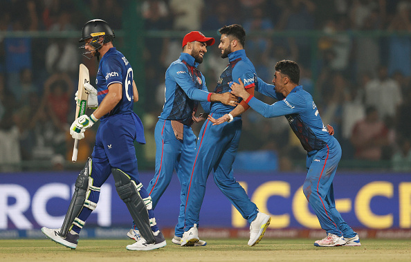 Naveen-ul-Haq celebrates the wicket of Jos Buttler | Getty